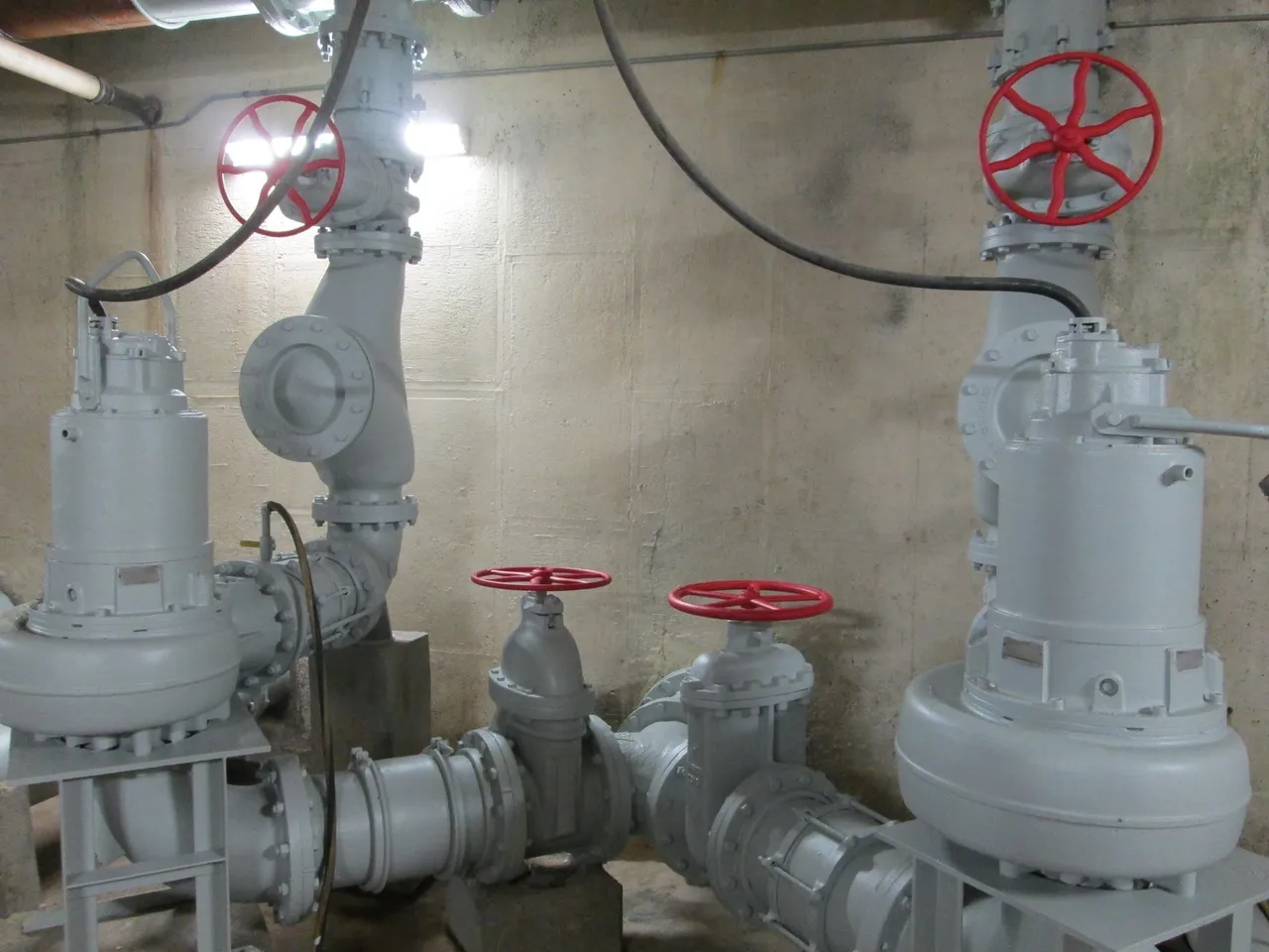 A view of pipes and valves in an industrial setting.