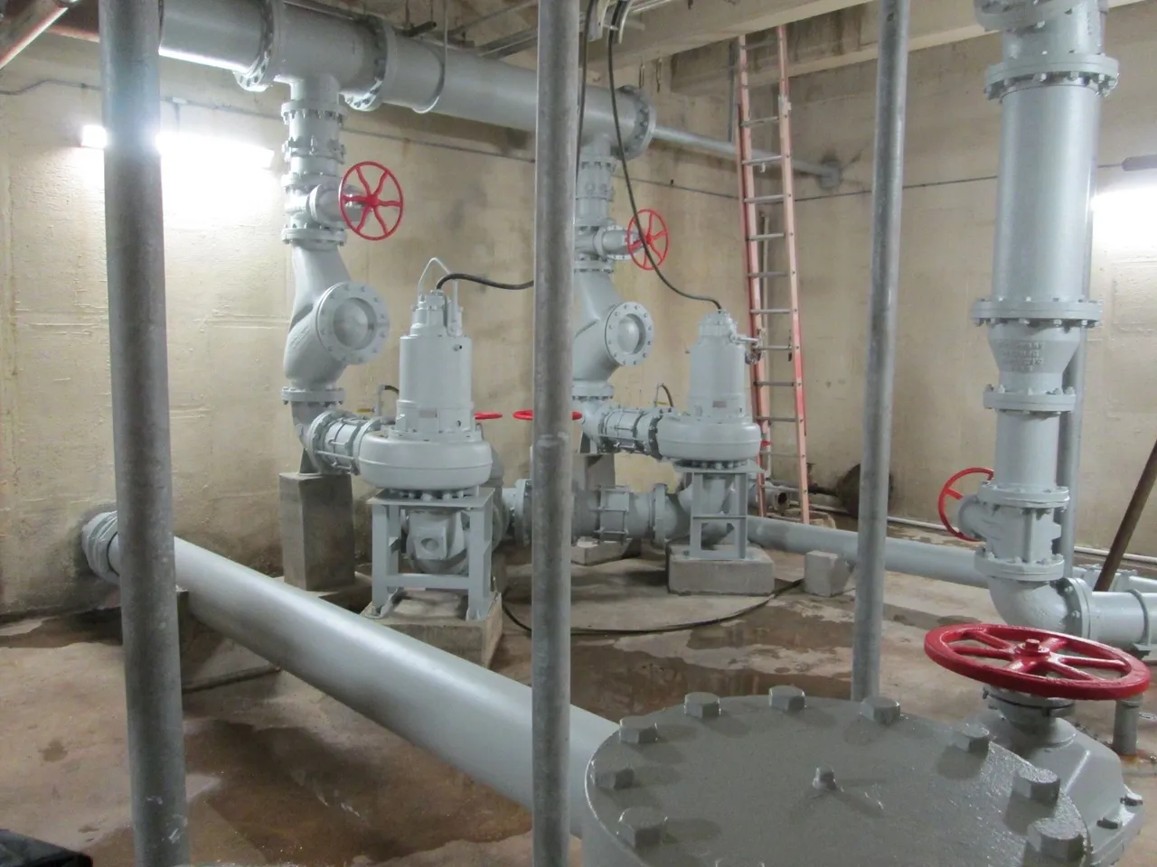 A large room with pipes and valves in it