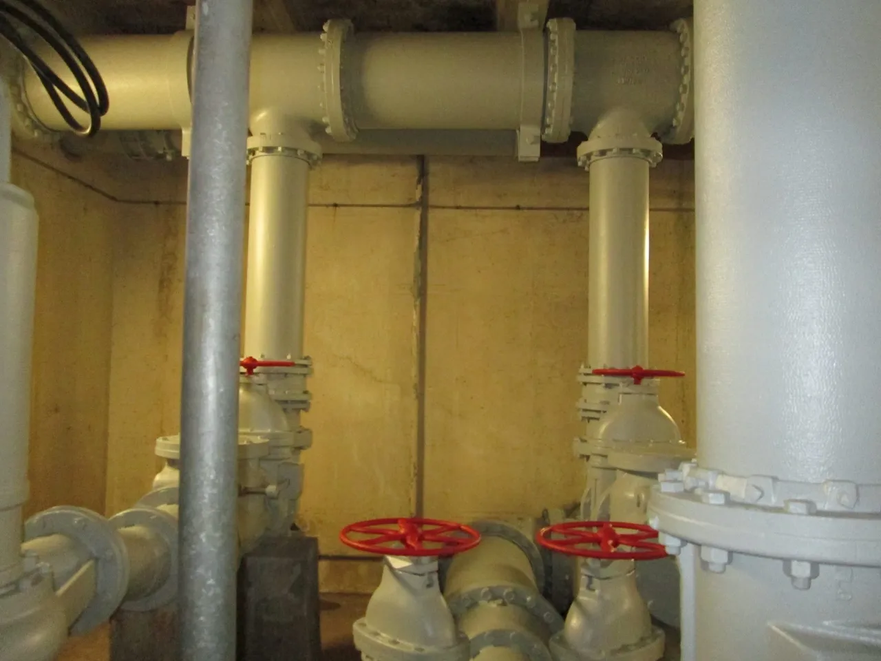 A view of pipes and valves in an industrial setting.